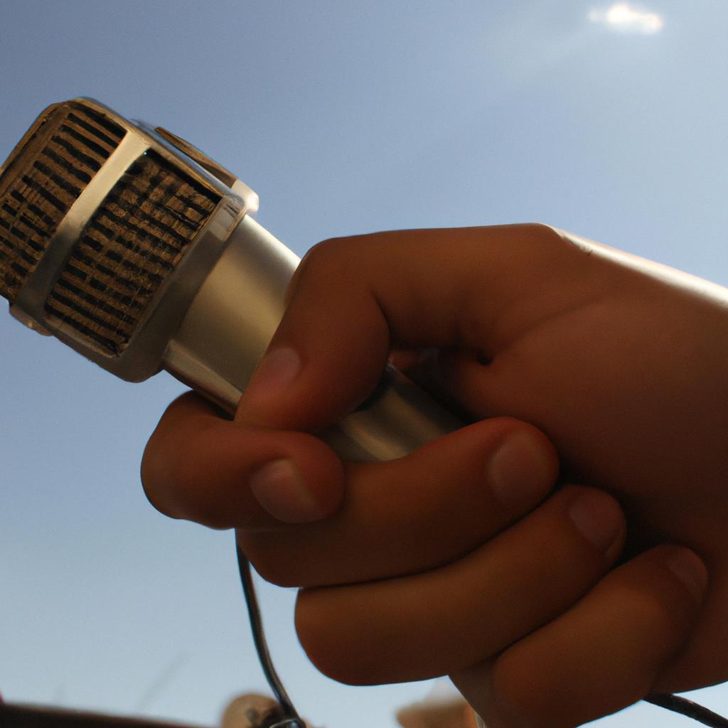 Person holding a radio microphone